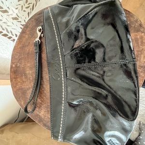 Black Coach patent leather clutch.